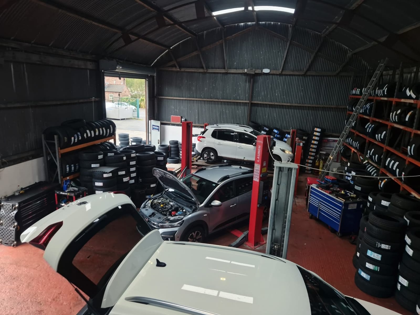 Busy workshop with multiple vehicles